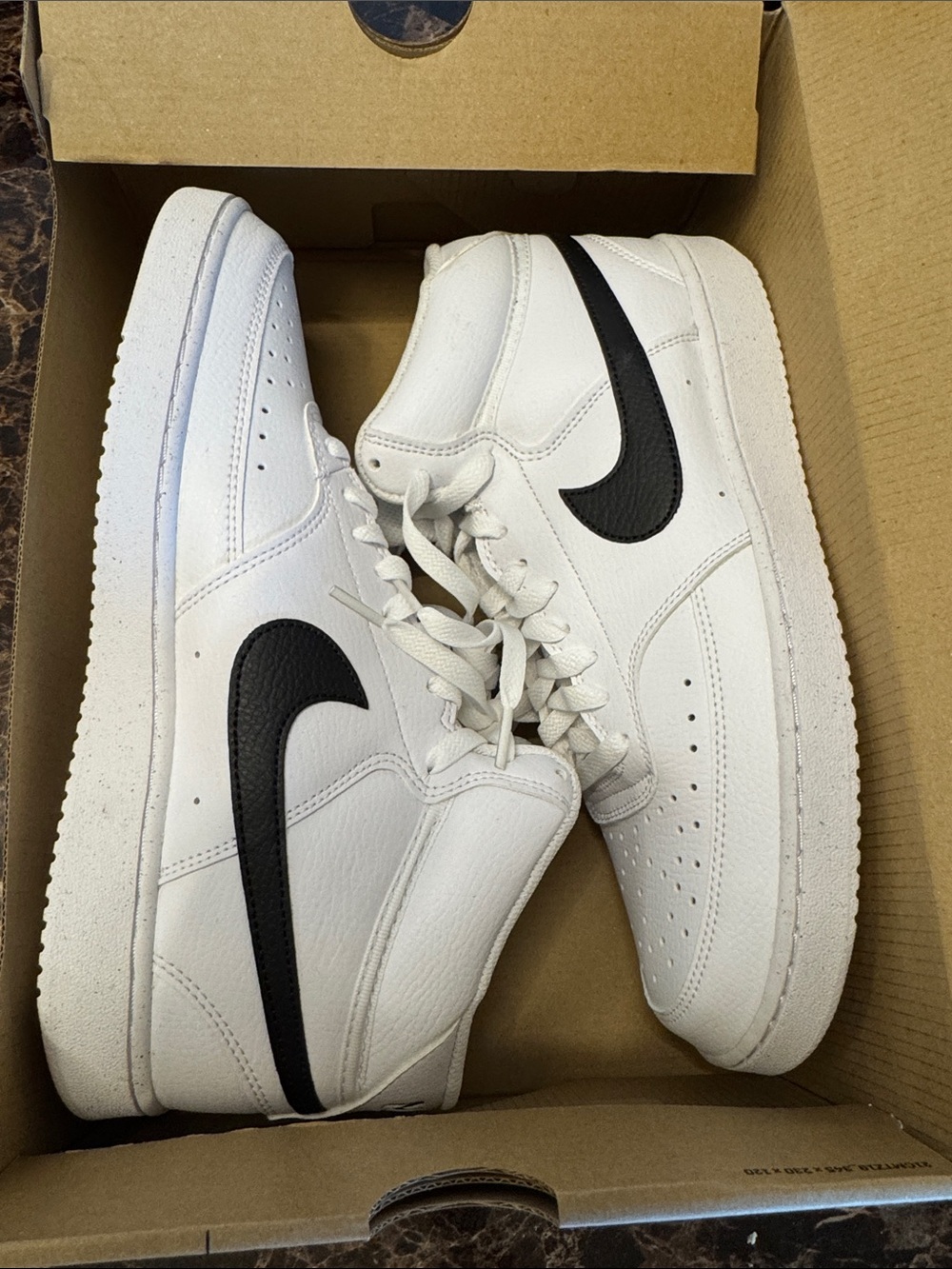 Nike White High-Top Sneakers with Black Swoosh